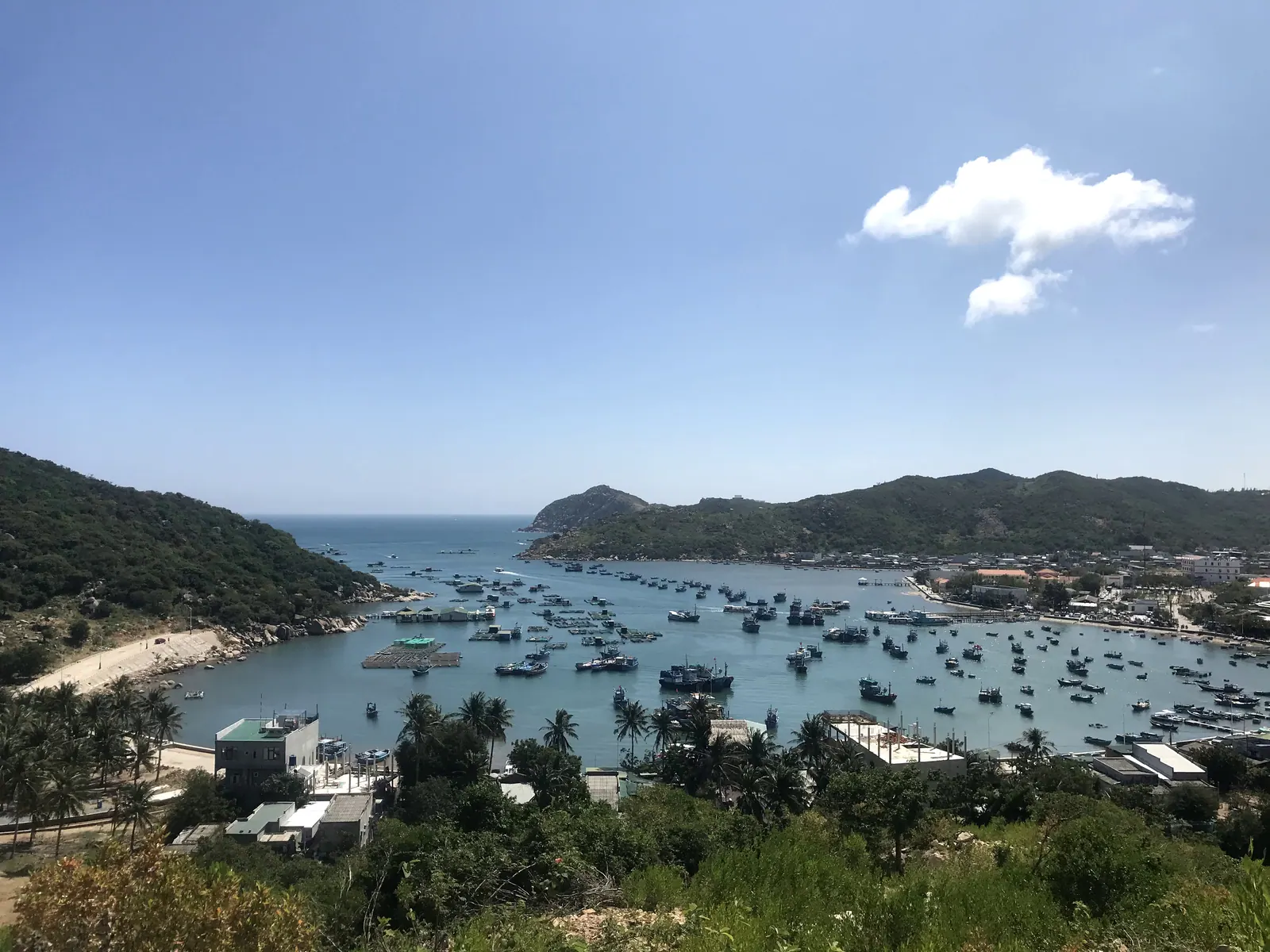 Vinh Hy Bay with moored boats and aquaculture rafts.